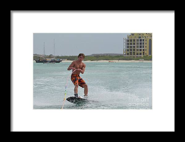 Wakeboard Framed Print featuring the photograph Athletic Wakeboarder Riding a Wakeboard off the Coast of Aruba by DejaVu Designs