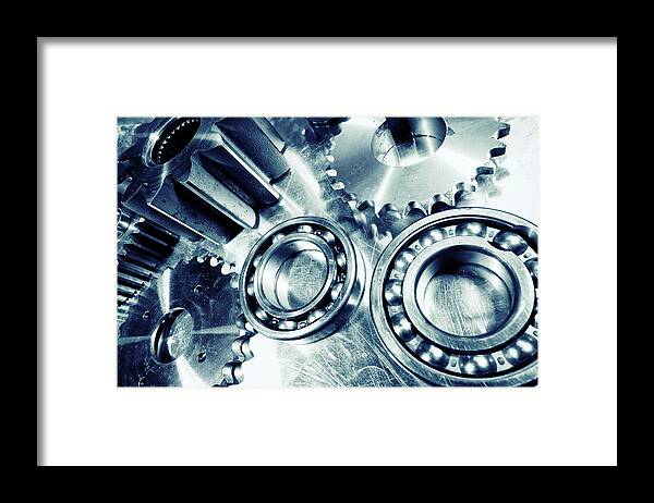 Cogwheels Framed Print featuring the photograph Ball-bearings And Cogs In Titanium by Christian Lagereek