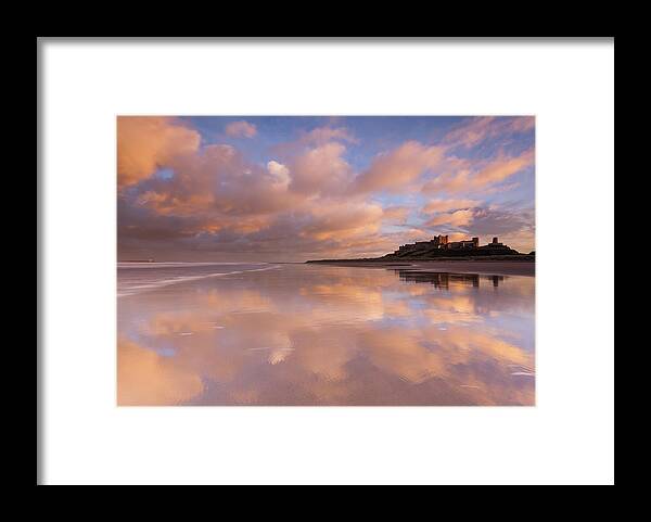 Bamburgh Castle Framed Print featuring the photograph Bamburgh Castle sunset reflections on the beach by Anita Nicholson