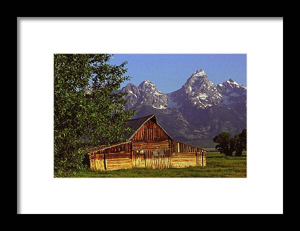 Grand Teton National Park Framed Print featuring the photograph Barn Against Tetons by Alan Lenk
