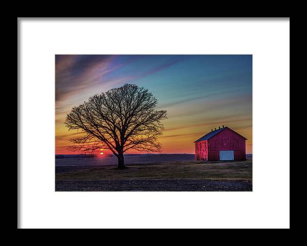 Oak Barn Sunset Red Country Farm Countryside Rural Americana Spring Colorful Horizontal Wisconsin Wi Madison Stoughton Framed Print featuring the photograph BarnSet - Wisconsin Rural Sunset with Oak and Barn by Peter Herman