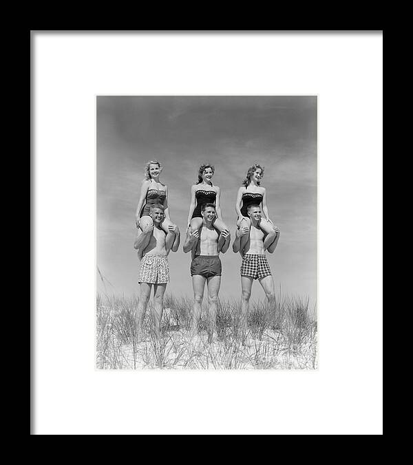 1950s Framed Print featuring the photograph Beach Balancing Act, 1950s-60s by H Armstrong Roberts and ClassicStock