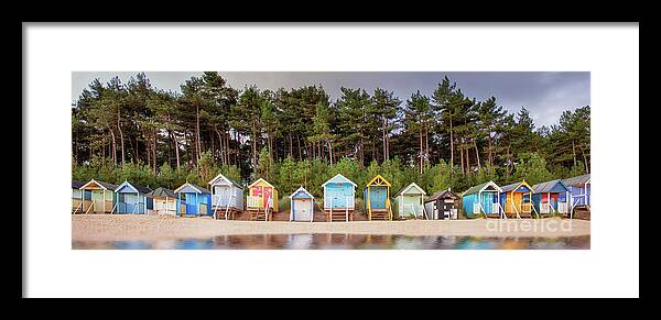 Wells Framed Print featuring the photograph Beach hut row on the Norfolk coast by Simon Bratt