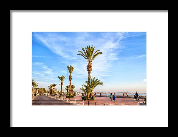 Africa Framed Print featuring the photograph Beach promenade of the african harbor city Agadir in Morocco by Gina Koch