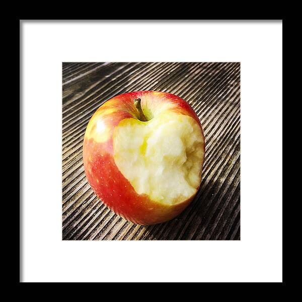 Apple Framed Print featuring the photograph Bitten red apple by Matthias Hauser