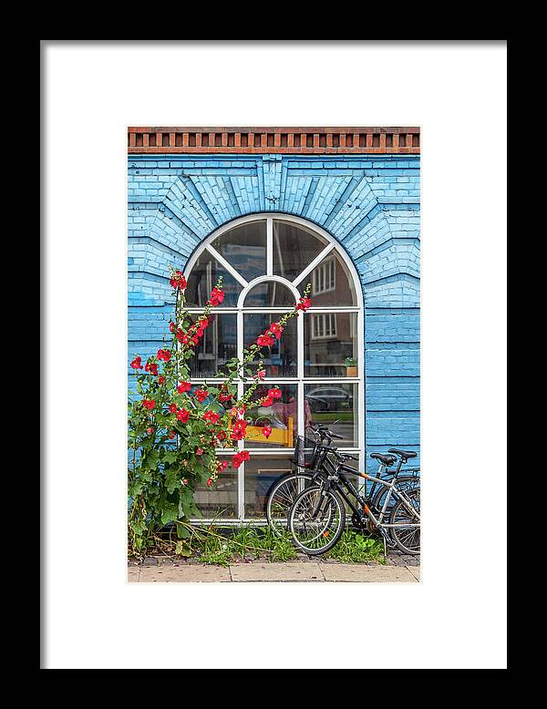Copenhagen Framed Print featuring the photograph Blue Brick Wall with Bicycles by W Chris Fooshee