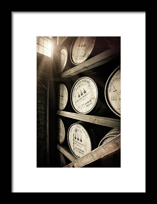 Bourbon Barrel Framed Print featuring the photograph Bourbon Barrels by Window Light by Karen Varnas