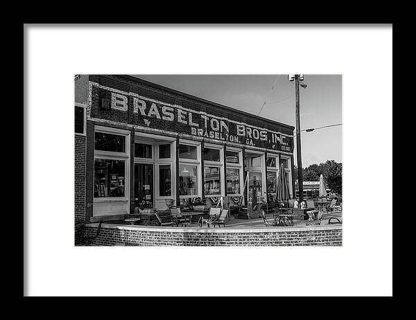 Braselton Framed Print featuring the photograph Braselton Bros Inc. Store Front in BW by Doug Camara