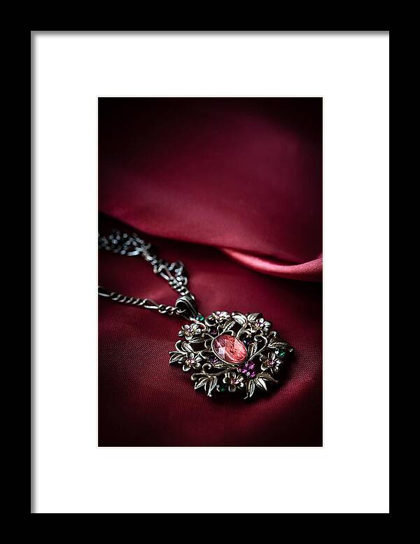 Brass Framed Print featuring the photograph Brass pendant with red gem by Jaroslaw Blaminsky
