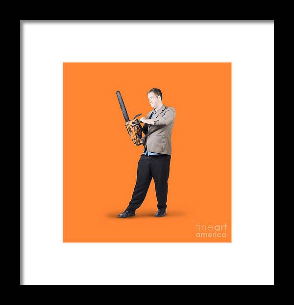 Chainsaw Framed Print featuring the photograph Businessman Holding Portable Chainsaw by Jorgo Photography