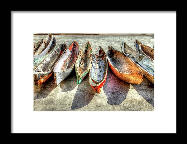 The Framed Print featuring the photograph Canoes by Debra and Dave Vanderlaan