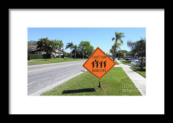 Caution Framed Print featuring the photograph Caution Dancers by Larry Mulvehill