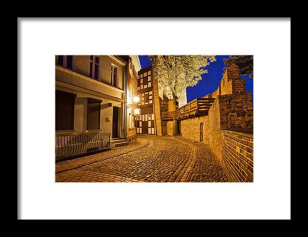 Leaning Framed Print featuring the photograph City of Torun at Night by Artur Bogacki