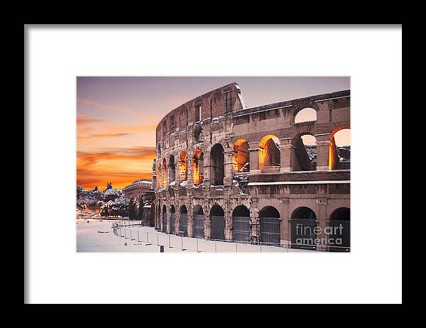 Colosseum Sunset Framed Print featuring the photograph Colosseum covered in snow at sunset by Stefano Senise