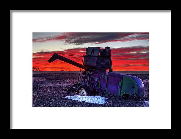 Combine Harvester Antique Abandoned Vintage John Deere Sunrise Landscape Red Green Snow Winter Framed Print featuring the photograph Combine Towards the Light by Peter Herman