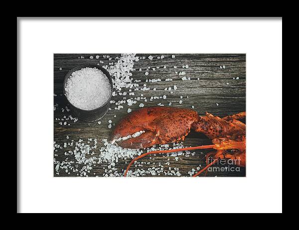 Cooked Framed Print featuring the photograph Cooked lobster claw with sea salt on wood by Sandra Cunningham