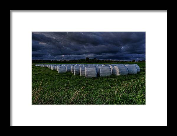 Farmer Framed Print featuring the photograph Covered Hay Bales by Dale Kauzlaric