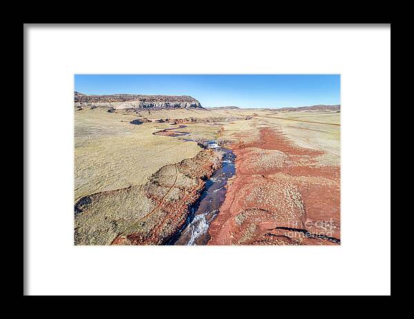 Colorado Framed Print featuring the photograph creek at Colorado foothills - aerial view by Marek Uliasz