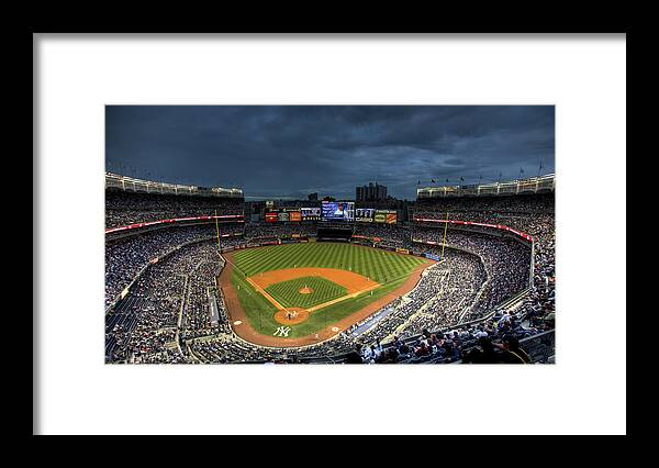 Yankee Stadium Framed Print featuring the photograph Dark Clouds over Yankee Stadium by Shawn Everhart