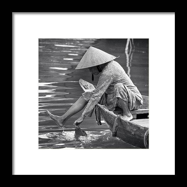Monochromatic Framed Print featuring the photograph Dipping A Toe In The River Of Hoi An by Jesper Staunstrup
