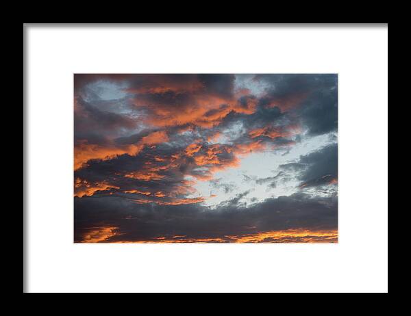 Stormy Clouds Framed Print featuring the photograph Dramatic sunset sky with orange cloud colors by Michalakis Ppalis