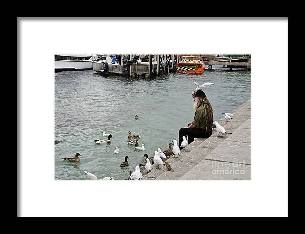 Dreadlocks Man Feeding Birds Framed Print featuring the photograph Dreadlocks man feeding birds by Yurix Sardinelly