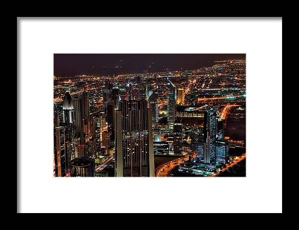 Dubai Framed Print featuring the photograph Dubai at Night by Shawn Everhart