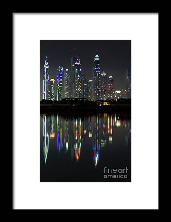 Dubai Framed Print featuring the photograph Dubai city skyline nighttime by Andy Myatt