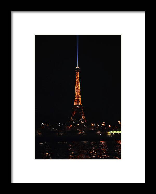 Travelpixpro Framed Print featuring the photograph Eiffel Tower and Searchlight at Night from the Seine River Paris France by Shawn O'Brien