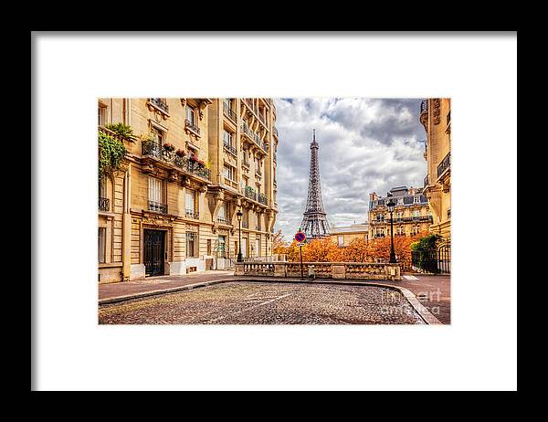 Paris Framed Print featuring the photograph Eiffel Tower seen from the street in Paris, France. Cobblestone pavement by Michal Bednarek