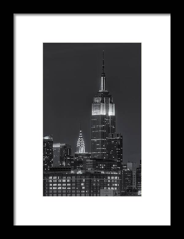 Clarence Holmes Framed Print featuring the photograph Empire State and Chrysler Buildings at Twilight IV by Clarence Holmes