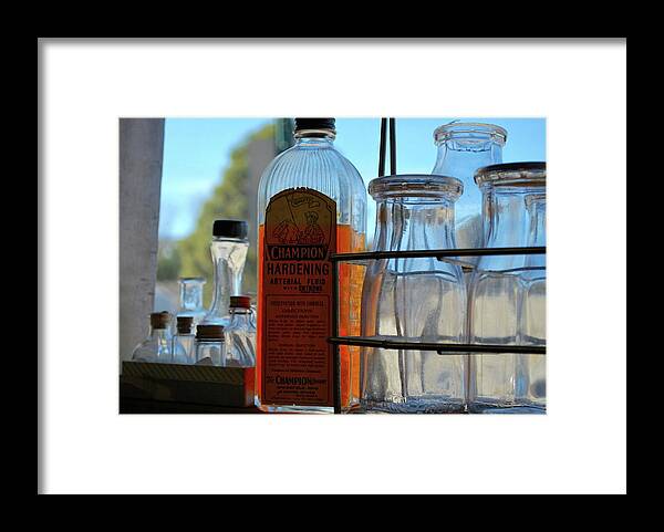 Embalming Fluid Framed Print featuring the photograph Expired on the shelf by Amee Cave
