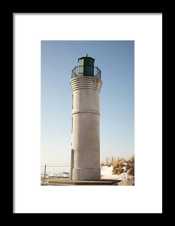 America Framed Print featuring the photograph Exterior of Robert H Manning Lighthouse, Empire, Michigan in win by Karen Foley