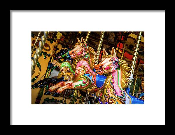 Amusement Ride Framed Print featuring the photograph Fairground Carousel Horses by Paul Warburton