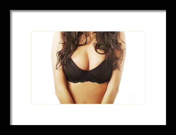 Female boobs in black bra Framed Print