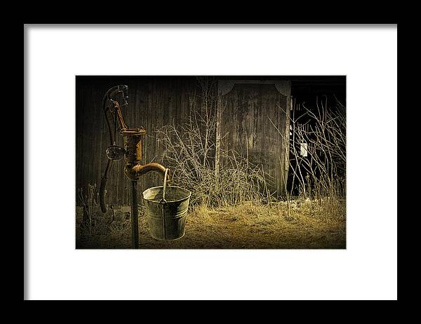 Pump Framed Print featuring the photograph Fetching Water from the Old Pump by Randall Nyhof