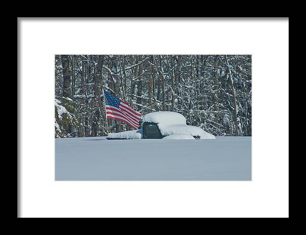 Snow Framed Print featuring the photograph Flag in the snow by David Bishop