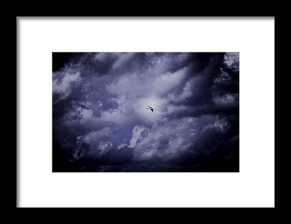 Clouds Framed Print featuring the photograph Fleeing the Storm by Jason Moynihan