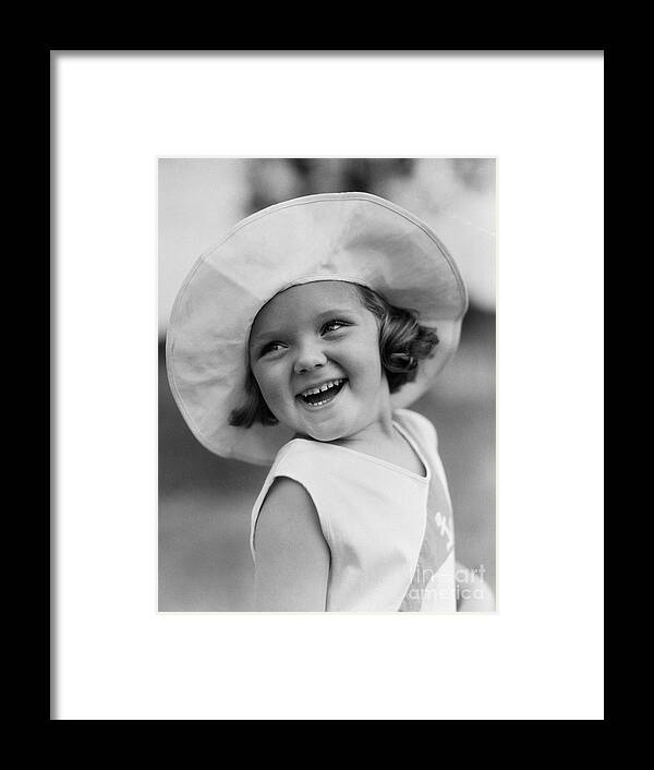 1930s Framed Print featuring the photograph Girl In Wide Brimmed Hat, C.1930s by H. Armstrong Roberts/ClassicStock