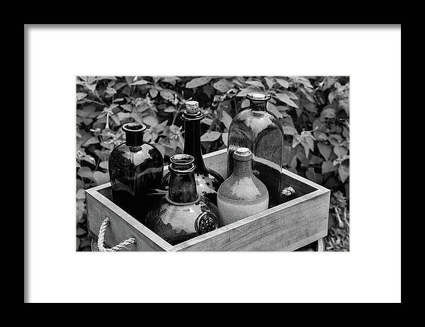 Antique Framed Print featuring the photograph Glass Bottles in the Garden by Nicole Lloyd