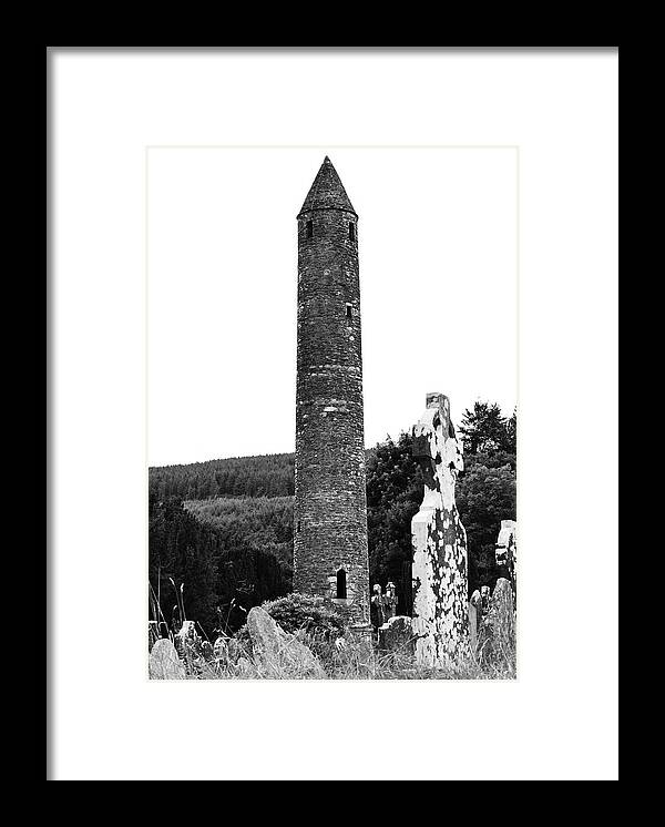 Glendalough Framed Print featuring the photograph Glendalough Round Tower and Celtic Cross Headstone County Wicklow Ireland Black and White by Shawn O'Brien