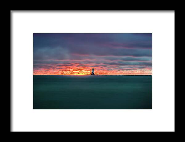 Ludington Mi Framed Print featuring the photograph Glowing Sunset on Lake With Lighthouse by Lester Plank