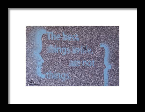 Graffiti Framed Print featuring the photograph Grafitti The best things in life are not things. by John Harmon