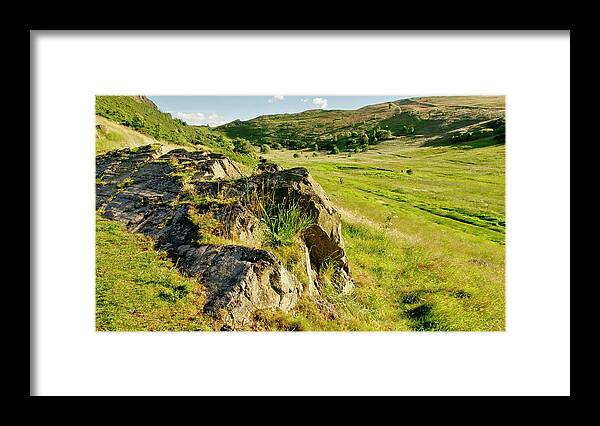 Grass Framed Print featuring the photograph Grassy slopes and grass on rocks. by Elena Perelman