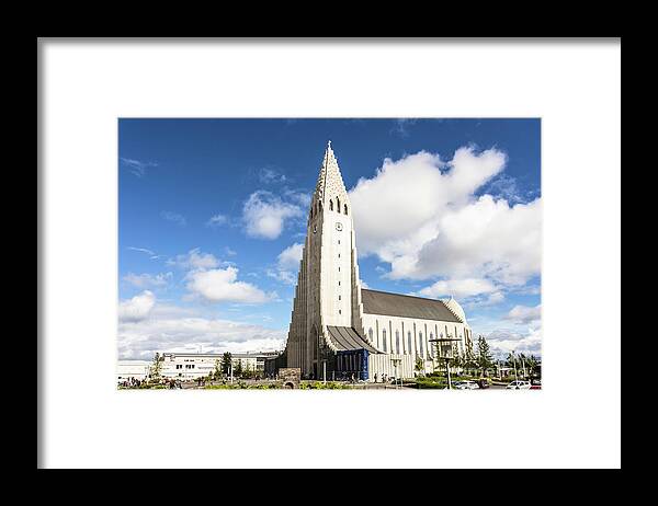 Capital Cities Framed Print featuring the photograph Hallgrimskirkja church in Reykjavik by Didier Marti