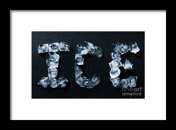 Letters Framed Print featuring the photograph Ice written with ice cubes on dark background by Simon Bratt