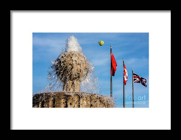 Tinas Captured Moments Framed Print featuring the photograph In Flight Over Flags by Tina Hailey