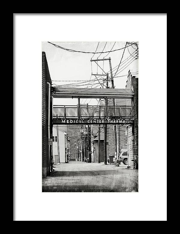 In Town Framed Print featuring the photograph In Town by Dark Whimsy