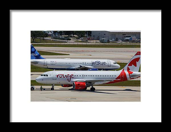 Rougem Canada Framed Print featuring the photograph Jetblue and Rouge Airliners by Dart Humeston