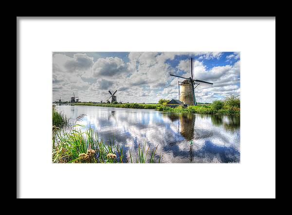 Windmills Framed Print featuring the photograph Kinderdijk by Uri Baruch